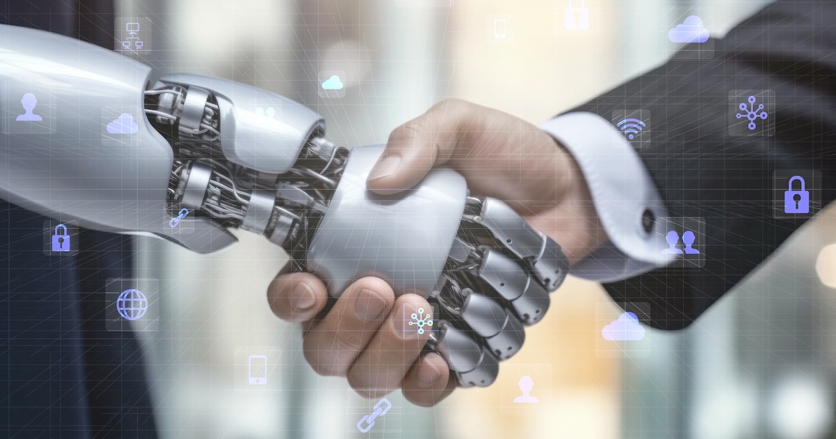 人間とロボットが握手する手元